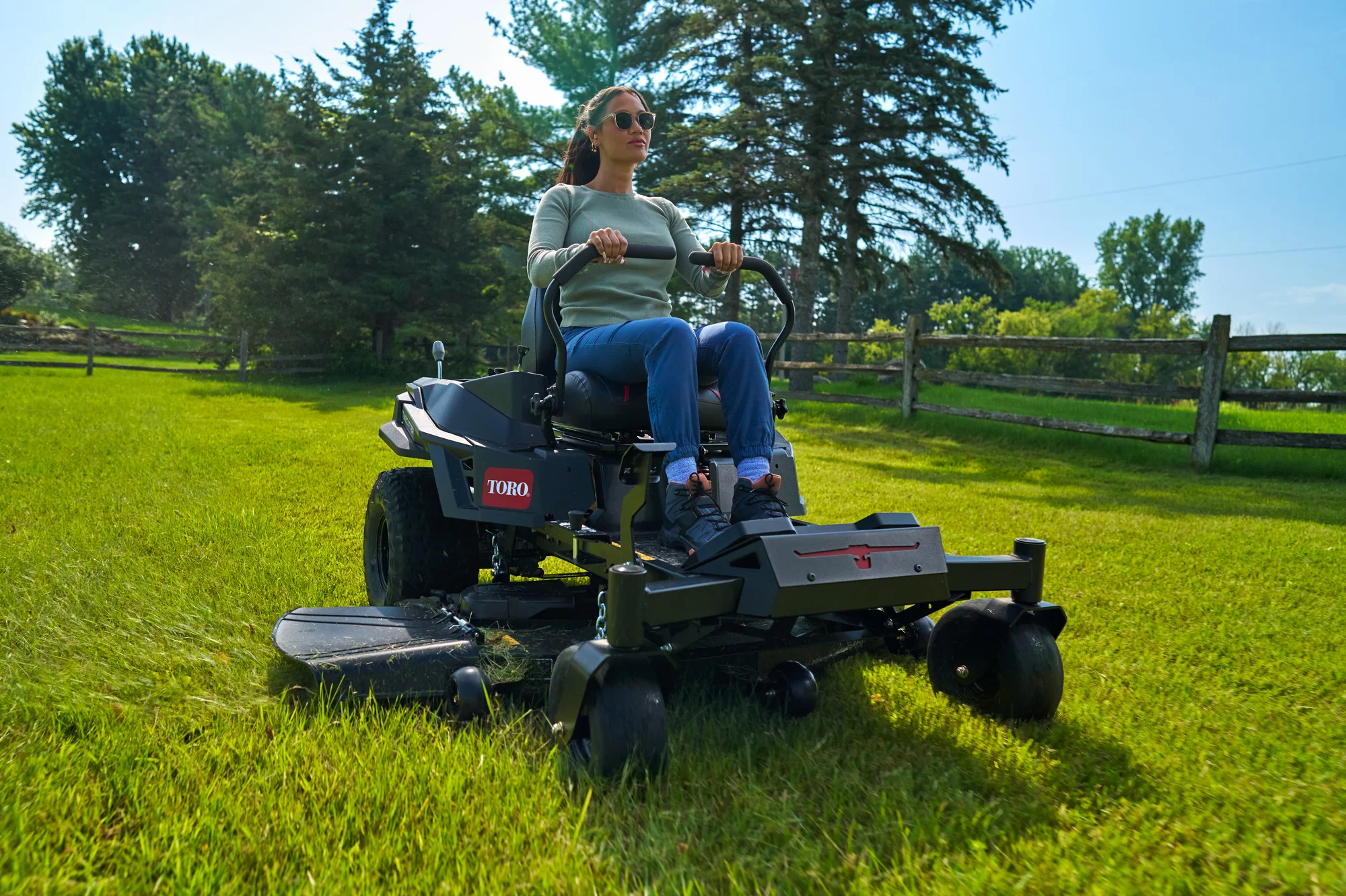 Toro Timecutter Max Havoc Myride Series Zero Turn Rider 77507 Woman Mowing Wide Angle product image