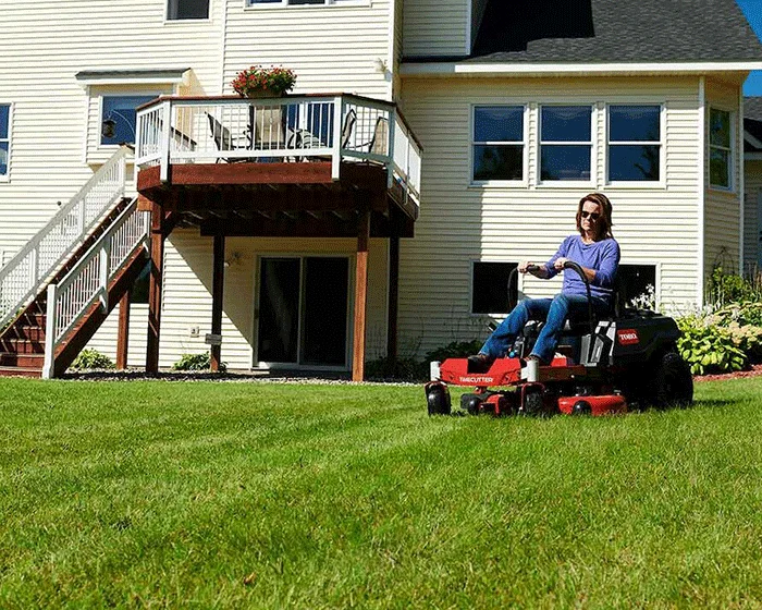 Toro TimeCutter Series Zero Turn Rider 77301 Toro Timecutter Series Zero Turn Rider 77301 Woman Mowing By House product image