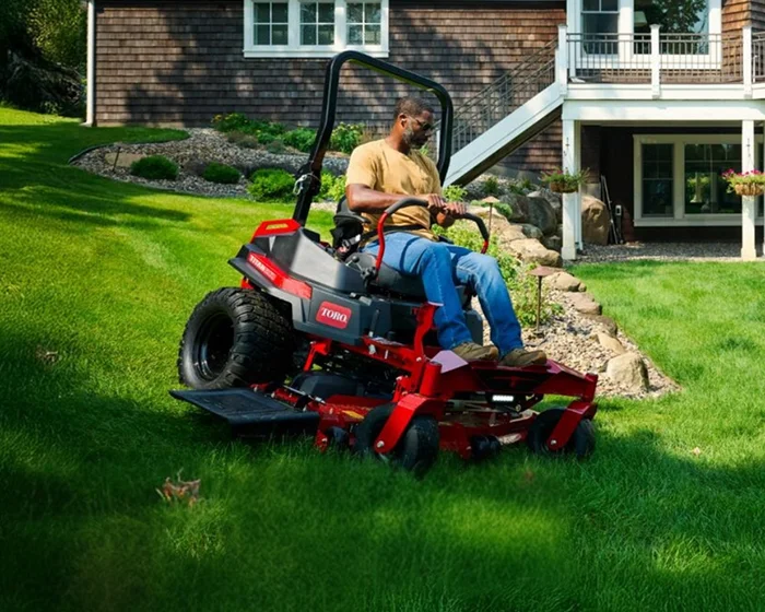 Toro Titan Max Series Zero Turn Rider 76606 Toro Titan Max Series Zero Turn Rider 76606 Man Mowing Hill product image