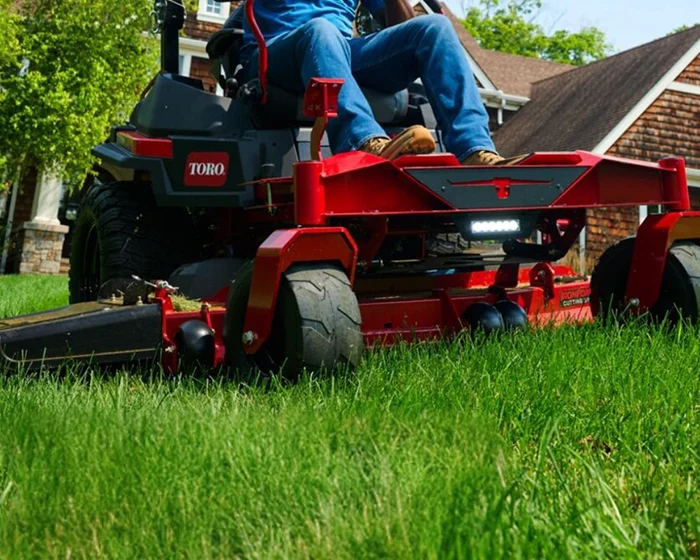 Toro Titan Max Series Zero Turn Rider 76606 Toro Titan Max Series Zero Turn Rider 76606 Mowing Lawn Closeup product image