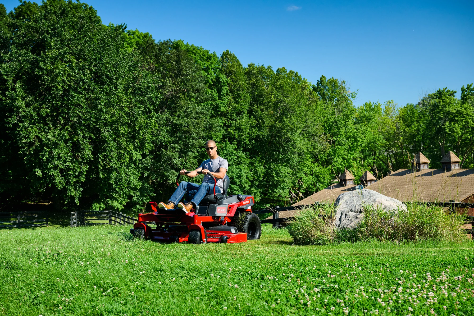 Toro Titan Series Zero Turn Rider 76614 Toro Titan Series 76614 Man Mowing Fence Front product image
