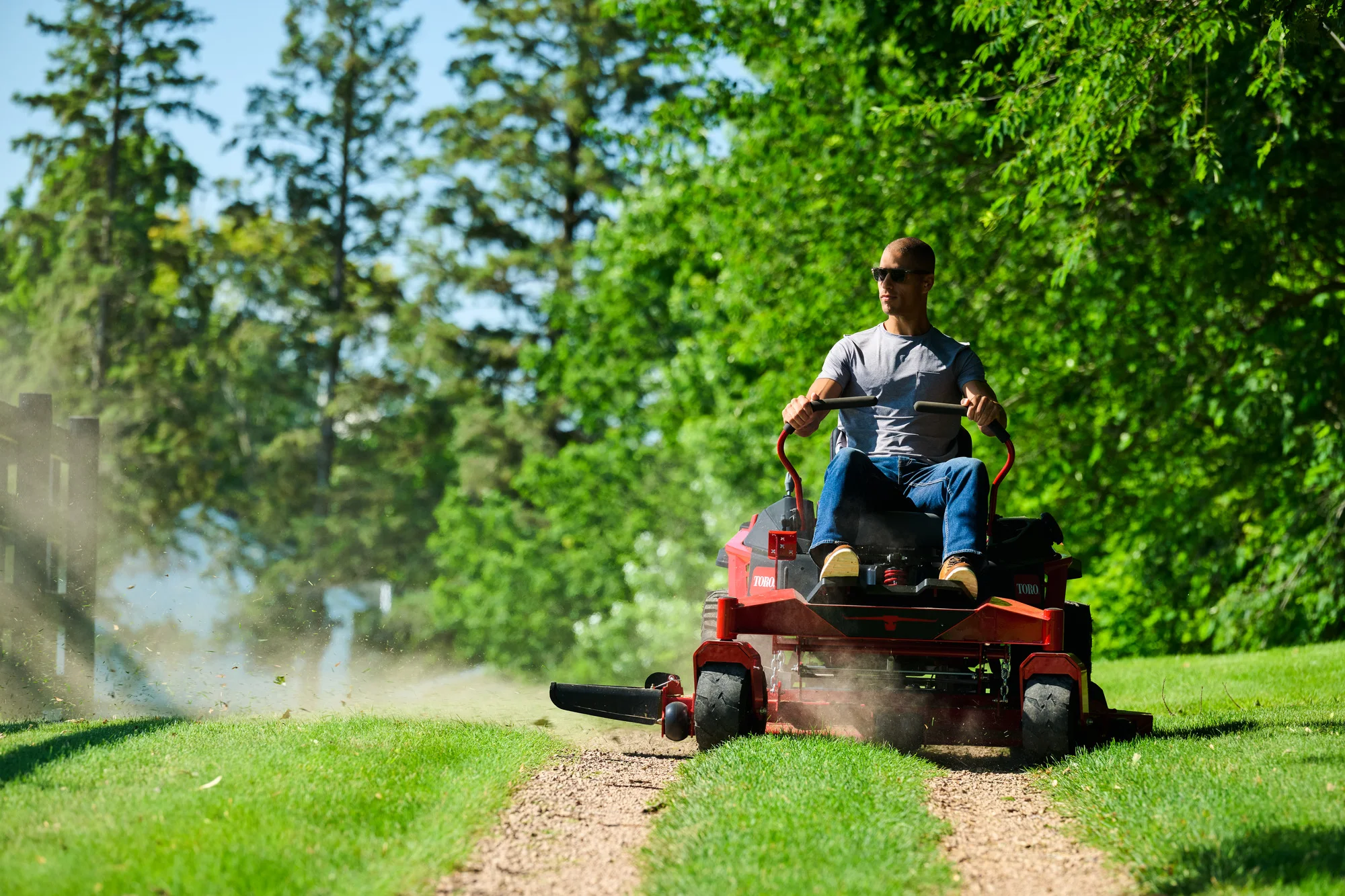 Toro Titan Series Zero Turn Rider 76614 Toro Titan Series 76614 Man Mowing Path Front product image