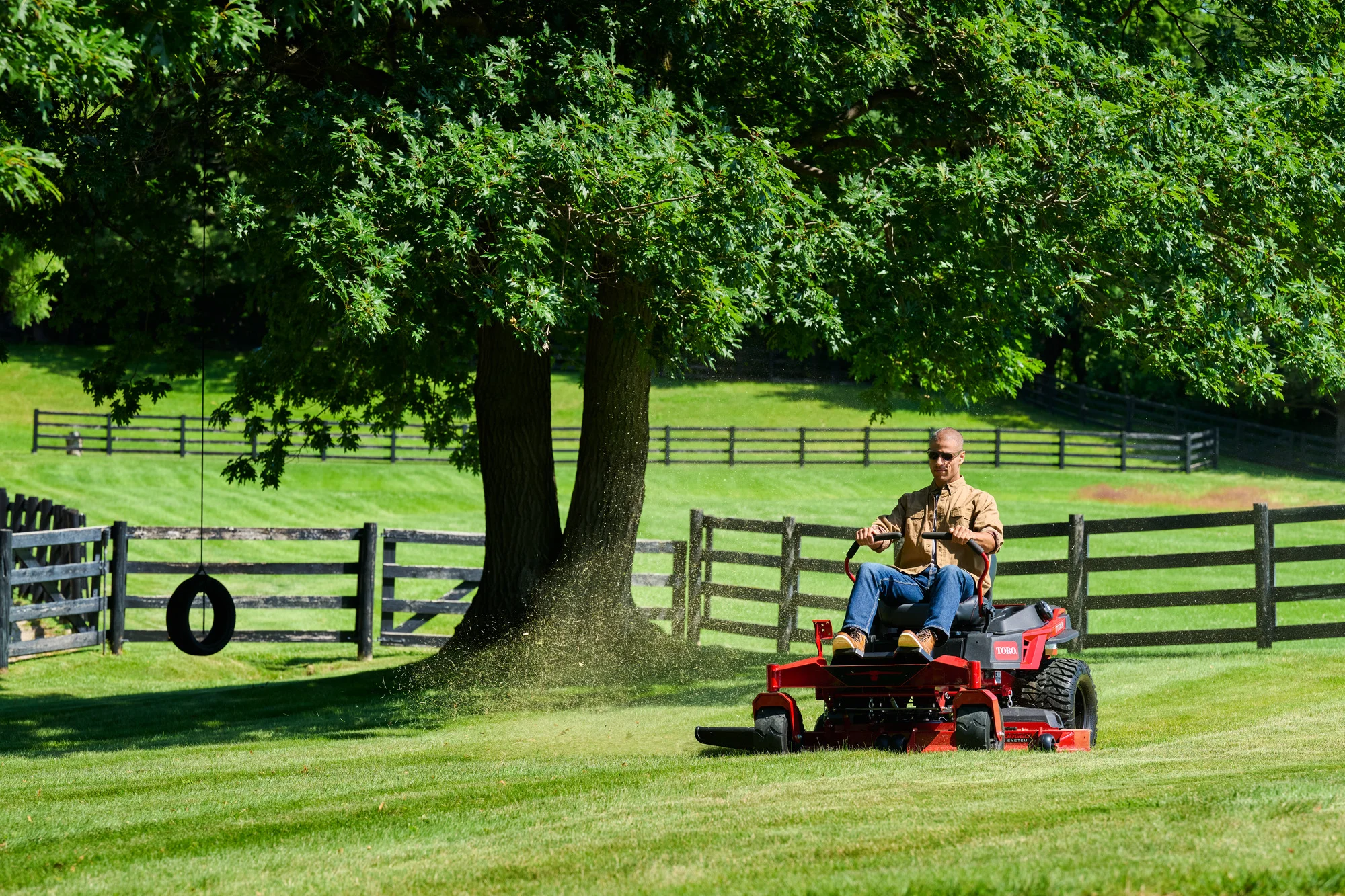 Toro Titan Series Zero Turn Rider 76614 Toro Titan Series 76614 Man Mowing Trees With Swing product image