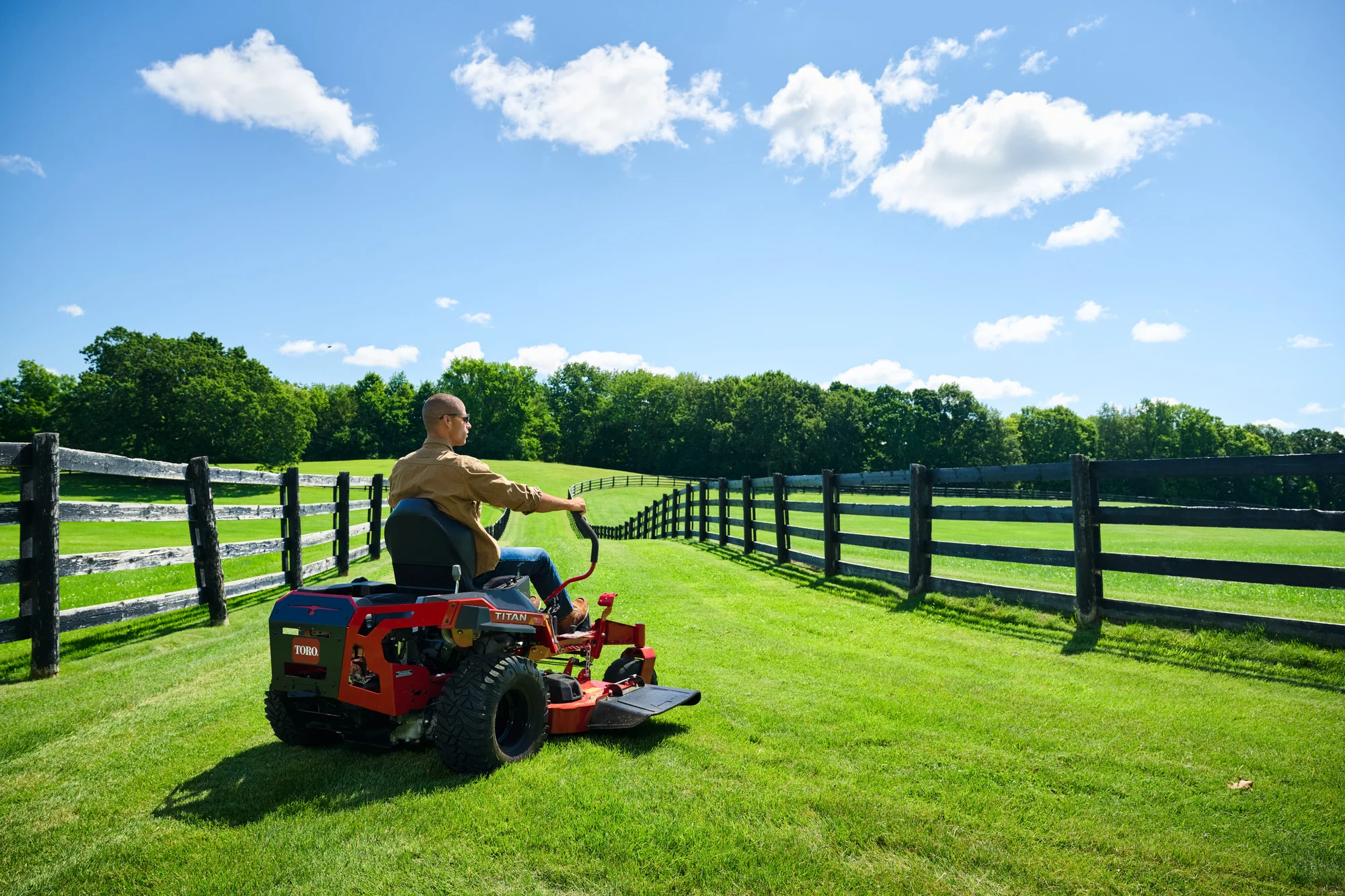 Toro Titan Series Zero Turn Rider 76614 Toro Titan Series 76614 Wide Angle Man Posing Mower Back product image