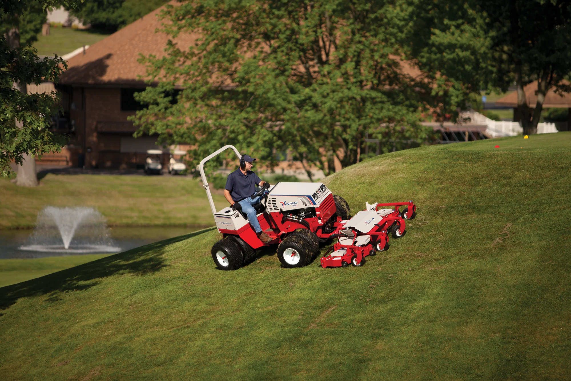 Ventrac P Series Compact Utility Tractors 4500P Front View Left Wide Man Cutting Lawn product image