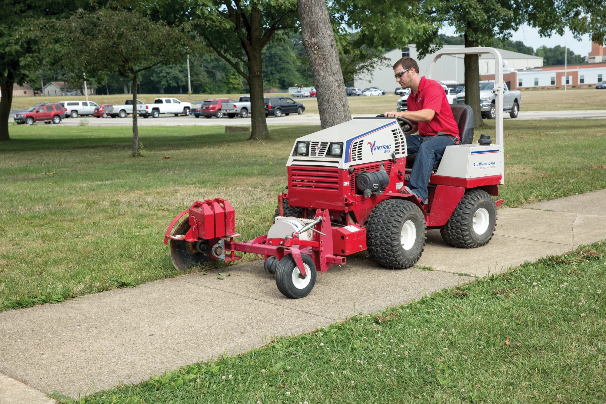 Used Ventrac 4500P All-Wheel Drive Articulating Tractor with 72 in Mower Deck TR5016FRTM Ventrac P Series Compact Utility Tractors 4500P Front View Right Edging Sidewalk product image