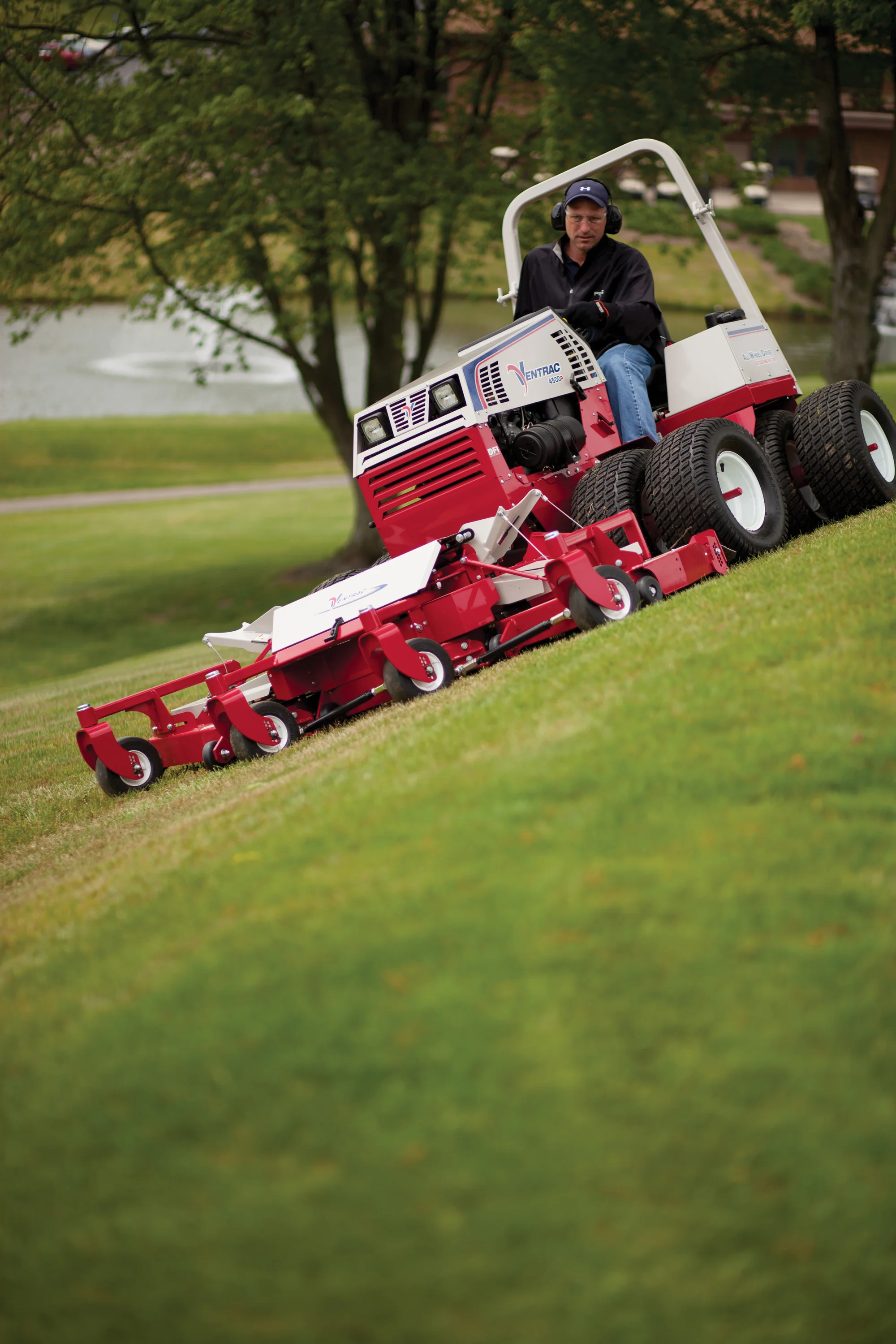Used Ventrac 4500P All-Wheel Drive Articulating Tractor with 72 in Mower Deck TR5016FRTM Ventrac P Series Compact Utility Tractors 4500P Front View Right Man Mowing Lawn product image
