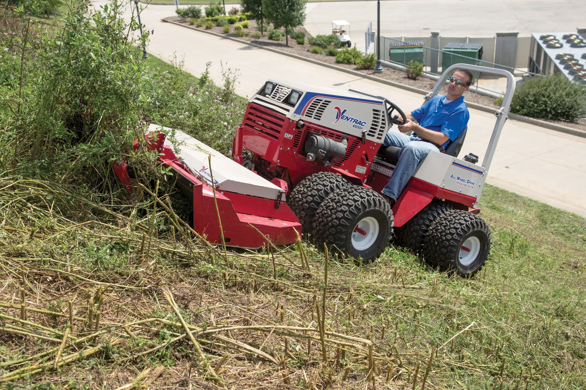 Used Ventrac 4500P All-Wheel Drive Articulating Tractor with 72 in Mower Deck TR5016FRTM Ventrac P Series Compact Utility Tractors 4500P Front View Right Mower Deck Clearing Weeds product image