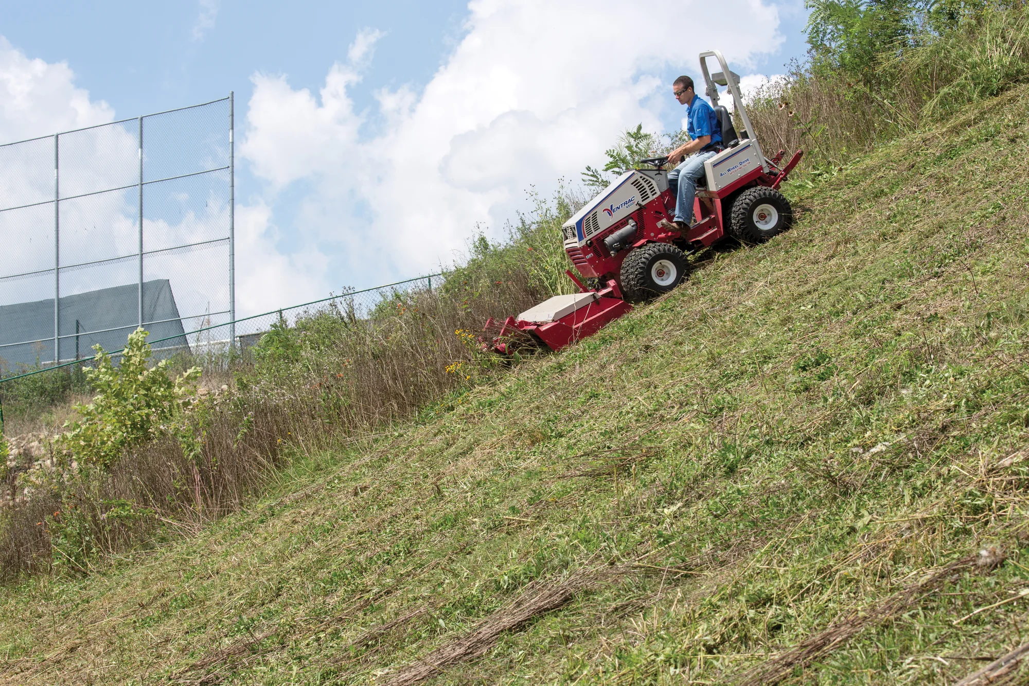 Ventrac P Series Compact Utility Tractors 4500P Side View Right Mower Deck Cutting Lawn product image