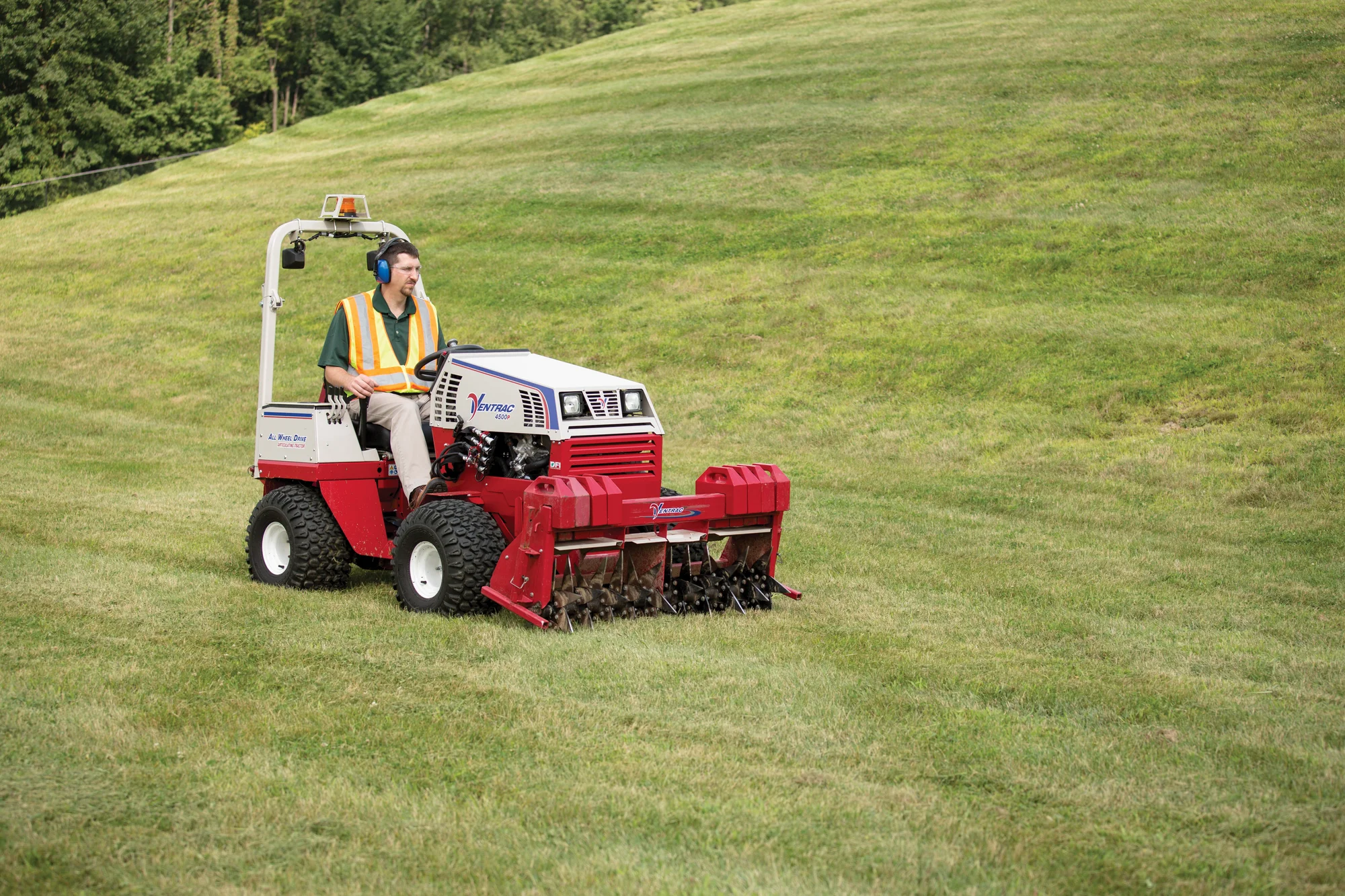 Ventrac 4520 Series Tractor 4520P Ventrac P Series Compact Utility Tractors 4520P Front View Left Man Grass product image