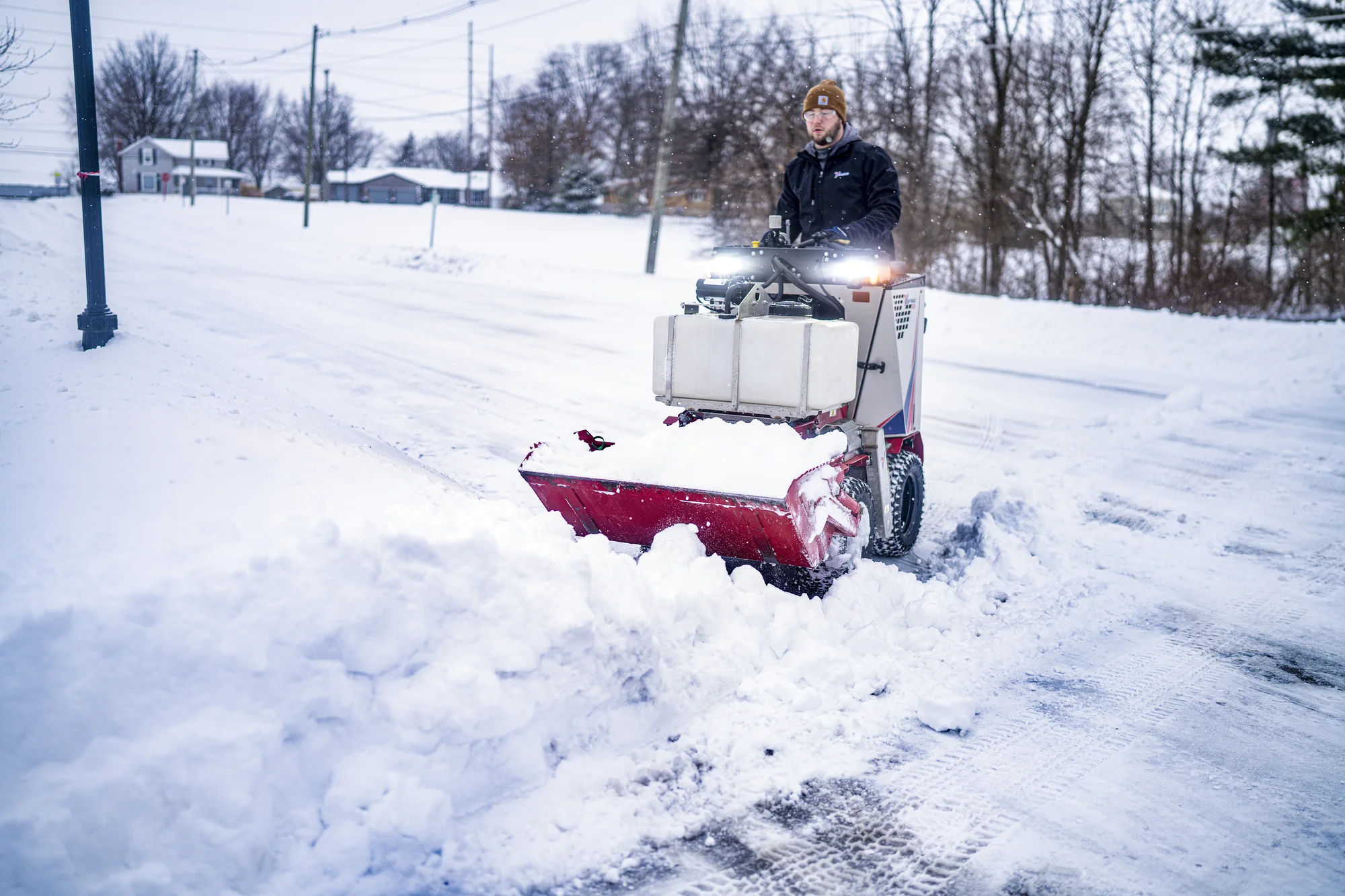 Ventrac Ssv Sidewalk Series Snow Vehicle 2120M Front View Left Clearing Snow product image