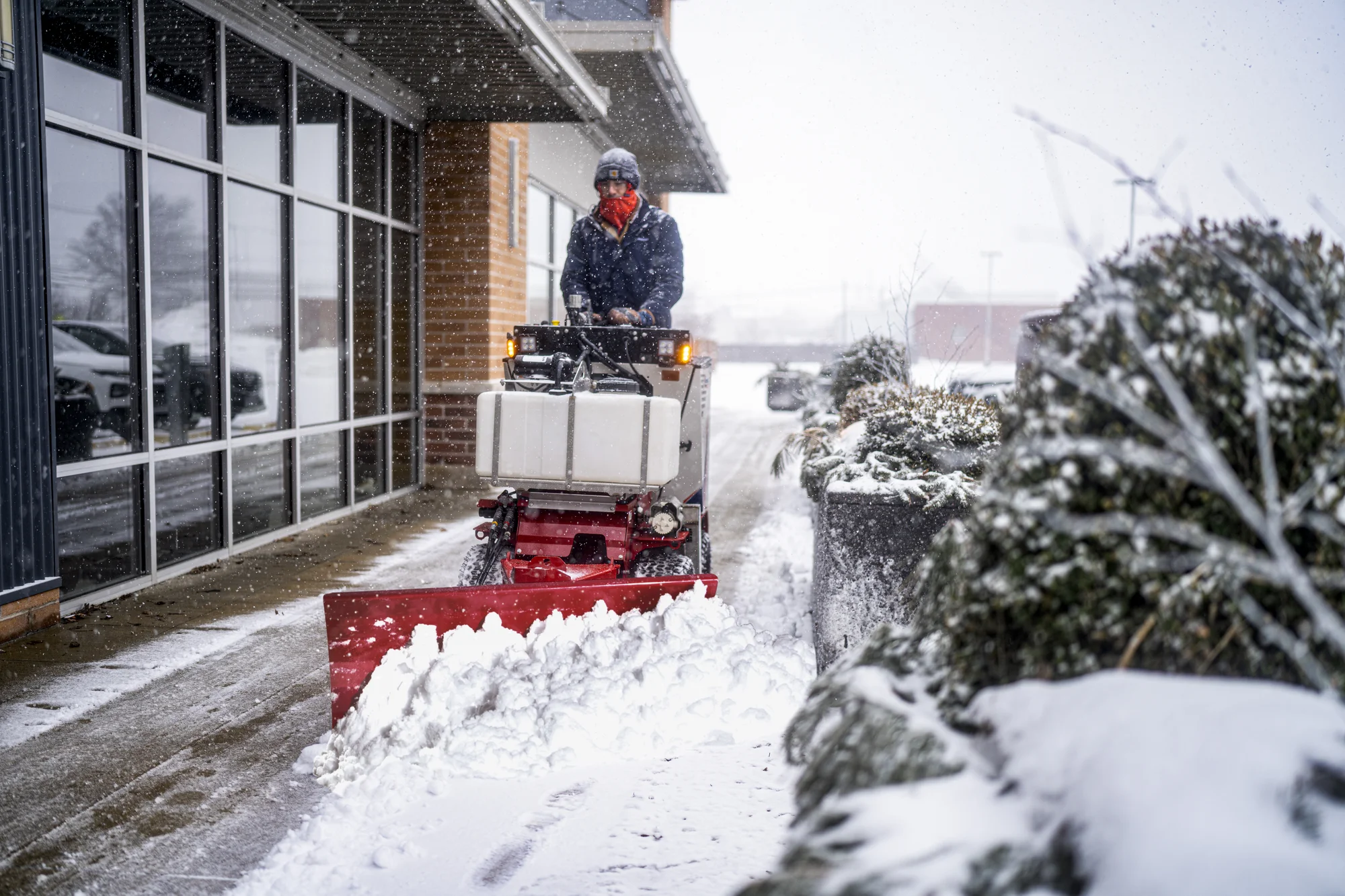 Ventrac Ssv Sidewalk Series Snow Vehicle 2120M Front View Man Clearing Sidwalk product image
