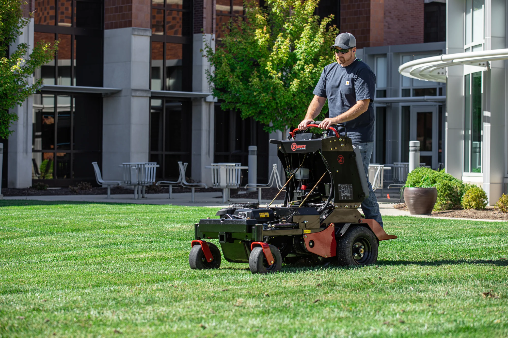 Z-Turf Z-Aerate 24 Stand-on Aerator ZA3624 Z Turf Z Aerate 24 Stand On Aerator Za3624 Front View Man On Equipment product image