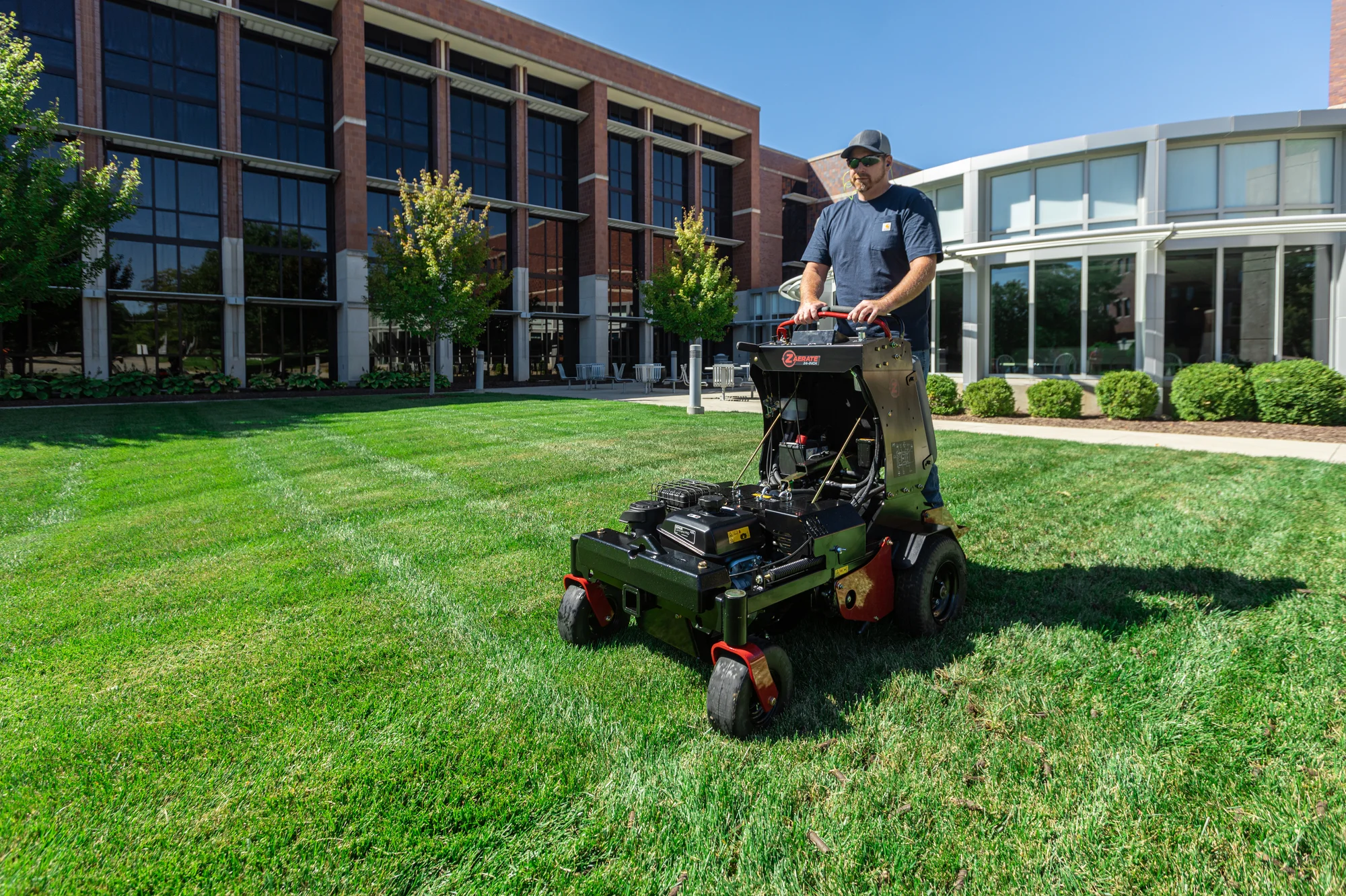 Z Turf Z Aerate 24 Stand On Aerator Za3624 Front View Man On Equipment Wide Angle product image