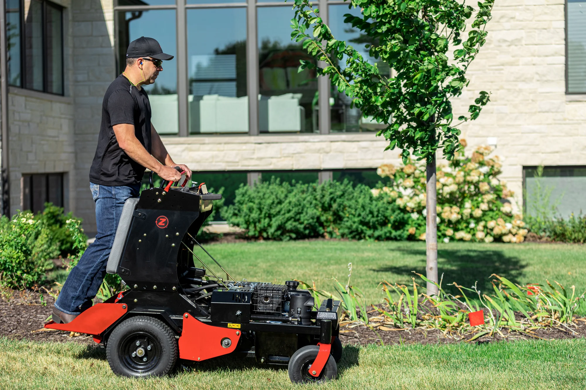 Z-Turf Z-Aerate 24 Stand-on Aerator ZA3624 Z Turf Z Aerate 24 Stand On Aerator Za3624 Side View Man On Equipment product image